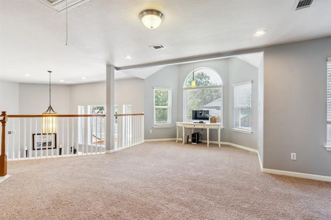 Large game room at the landing atop of the stairs | Image 27