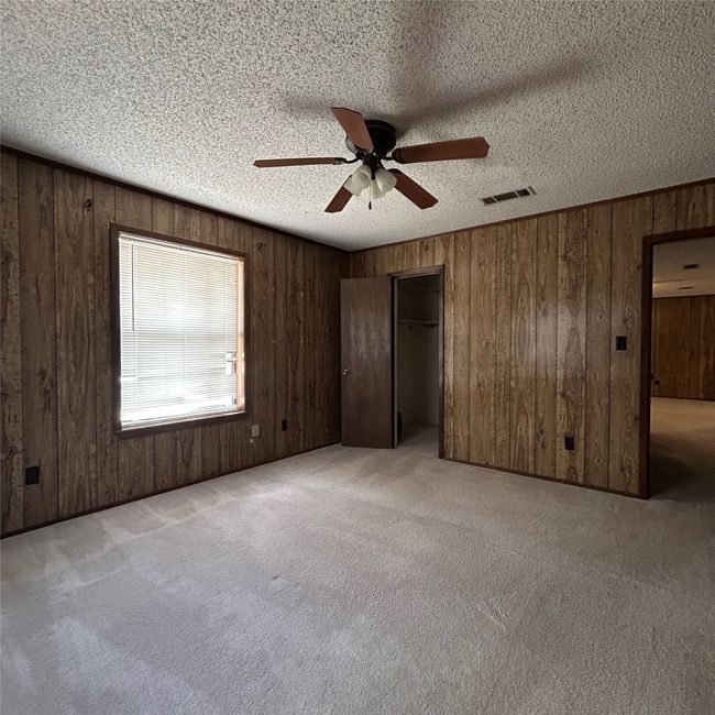 Carpeted spare room featuring visible vents, ceiling fan, and a textured ceiling | Image 20