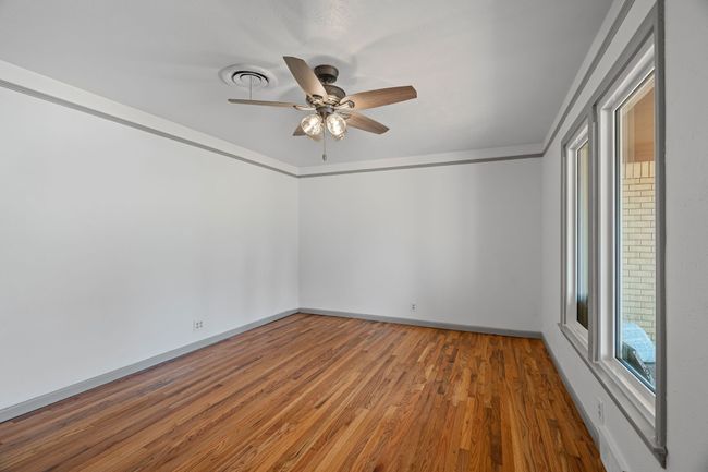 Living room featuring a ceiling fan and wood finished floors | Image 6