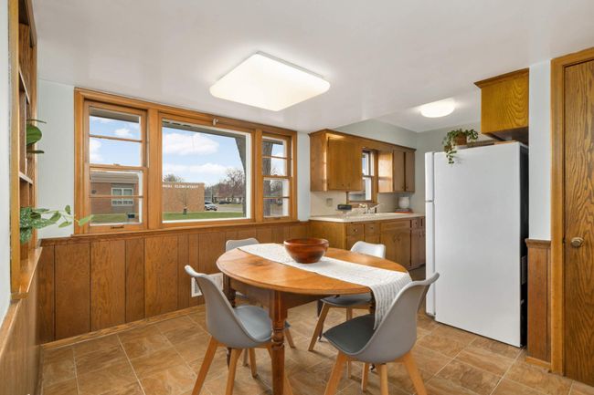 Also drenched in light, there is a great view of the street from the dining room./ | Image 13