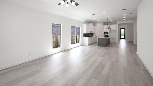 Unfurnished living room with recessed lighting, light wood-type flooring, and ceiling fan | Image 9