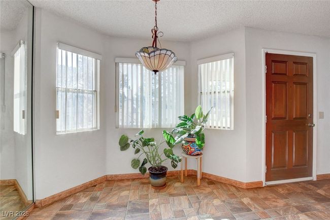 Entryway with baseboards and a textured ceiling | Image 17