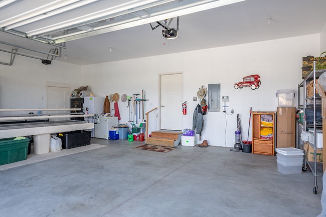 3 car garage attached to house, cabinets excluded from sale | Image 26
