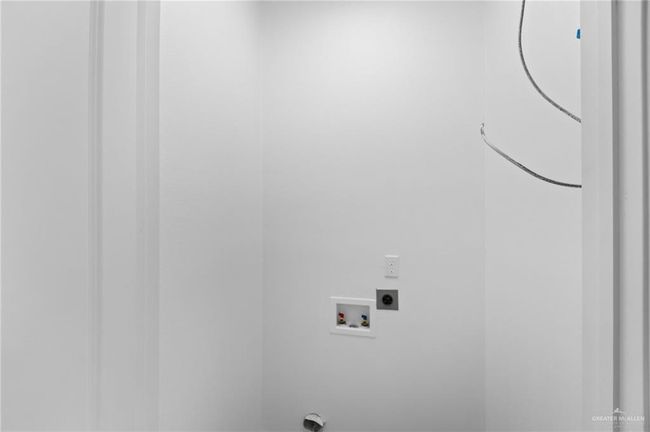 Washroom featuring hookup for a washing machine and electric dryer hookup | Image 17