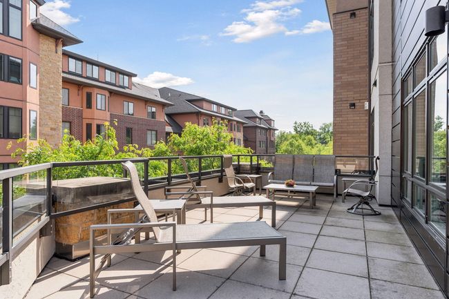 Additional gathering area on the spacious balcony patio | Image 27