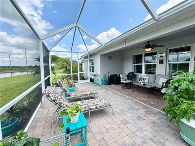 Unfurnished sunroom featuring a water view and ceiling fan | Image 2