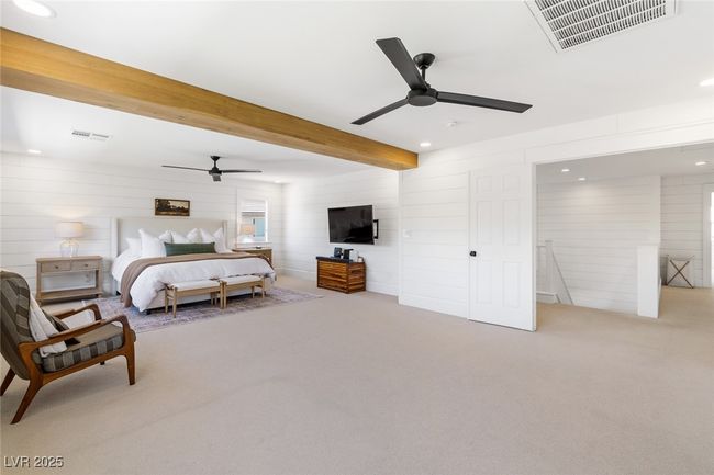 Bedroom featuring beamed ceiling, carpet floors, visible vents, and recessed lighting | Image 24