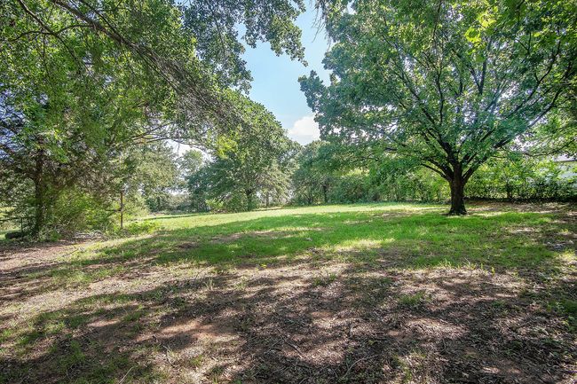View of yard featuring a view of trees | Image 28