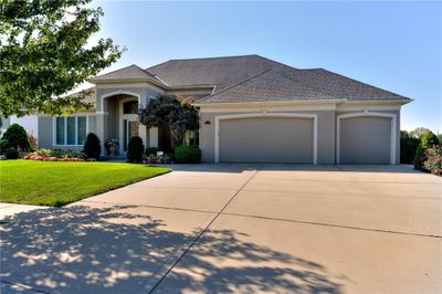 View of front of property featuring a garage and a front lawn | Image 2