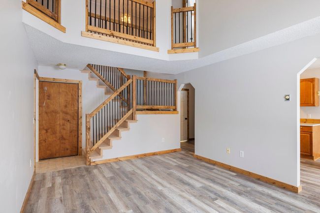 Livingroom with stair view | Image 6