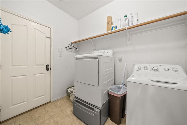 Laundry room with independent washer and dryer | Image 12
