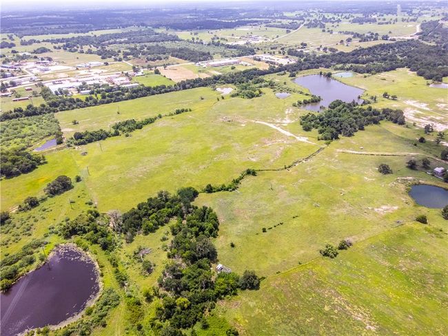 Aerial view of property and surrounding area featuring a large body of water | Image 4