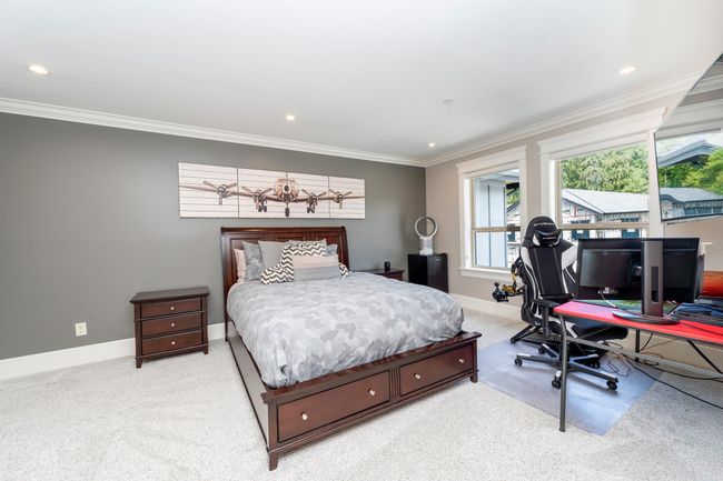 Bedroom with recessed lighting, baseboards, light colored carpet, and ornamental molding | Image 18