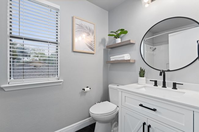 Bathroom featuring vanity and a shower | Image 26