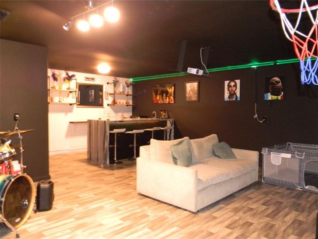 Flex room behind the garage: Game room, office, gym, media room or perfect for relaxation and entertainment. | Image 15