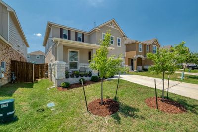 Indulge in luxury living within this exquisitely designed and meticulously maintained 2-story residence, nestled in the coveted Villas at Star Ranch community. | Image 2