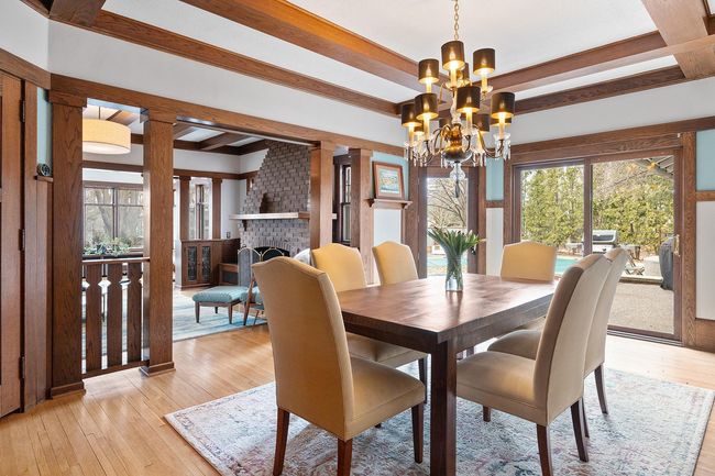 Large dining room with access and views of the pool area | Image 15