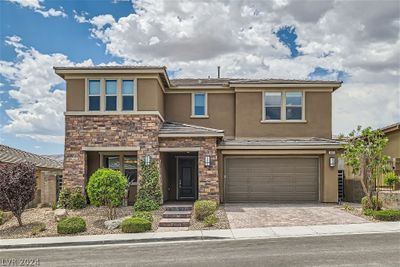 Impressive exterior against backdrop of mountain panorama. | Image 1