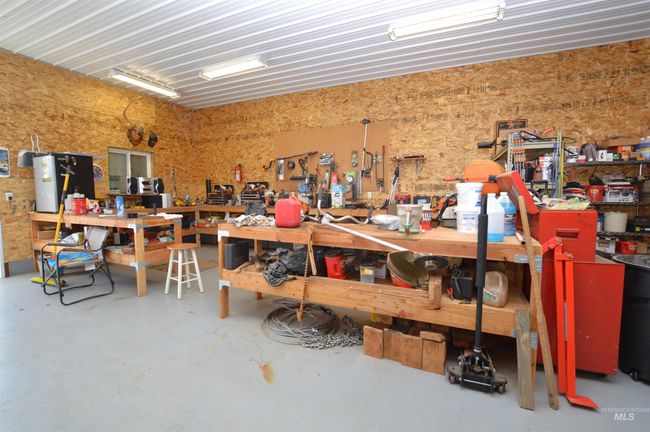 Garage with a workshop area | Image 30