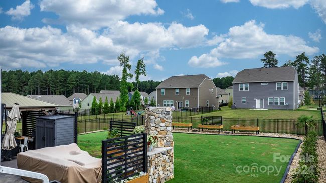 Great yard for family and pets! Custom raised planters will stay! | Image 39
