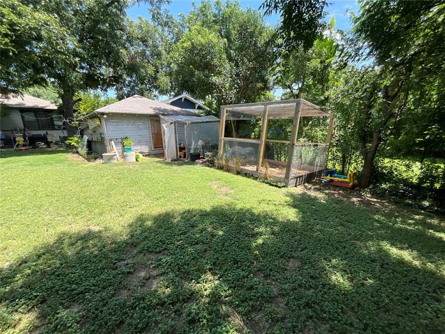 View of grassy yard featuring an outbuilding | Image 15