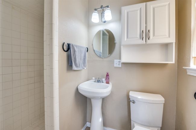 Bathroom with tiled shower and toilet | Image 23