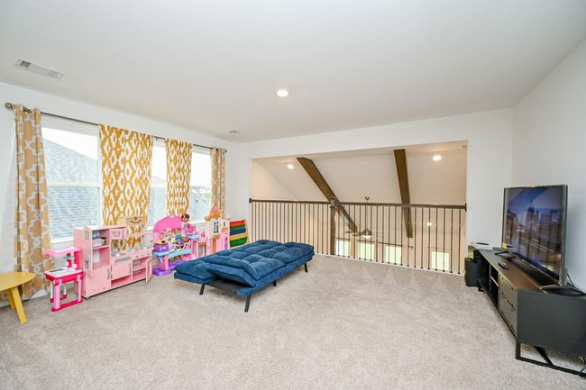 Expansive upstairs game room provides plenty of space for play, or relaxation | Image 9