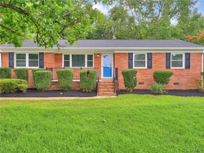 Single story home featuring a front yard | Image 1