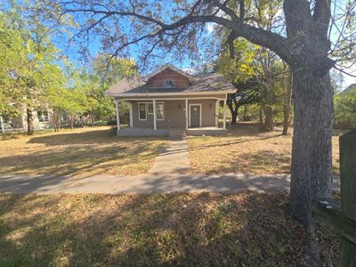 View of front facade featuring a porch | Image 1