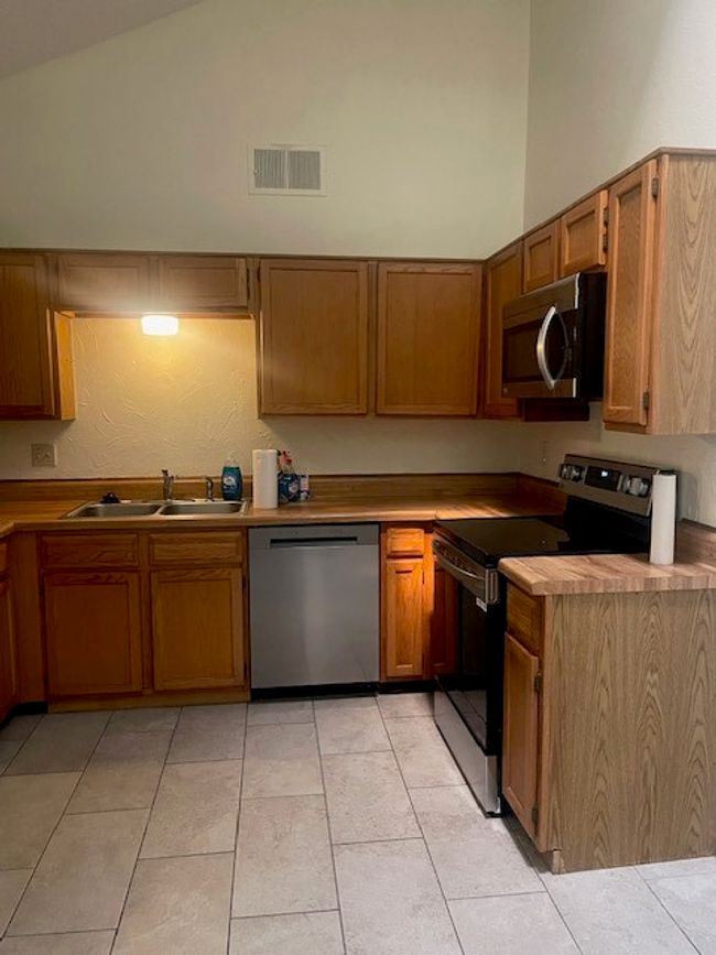Newer LG appls, tiled floors, lined shelves, clean and ready. | Image 10