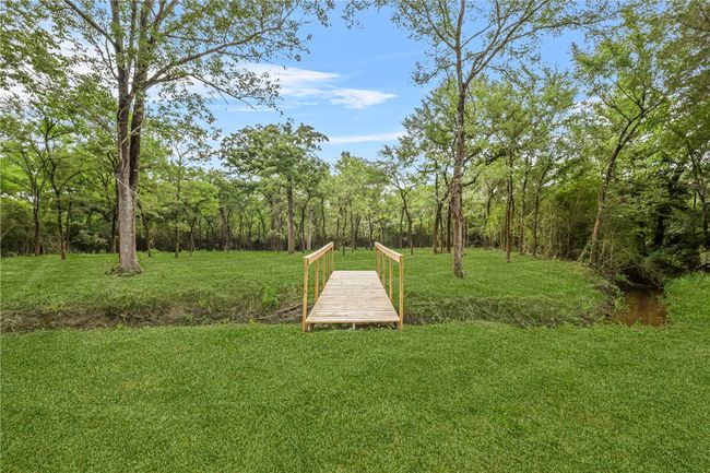 View of back yard from deck | Image 24