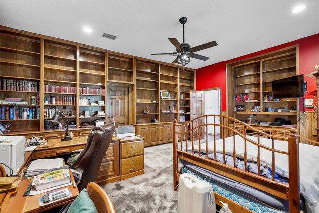 Office with ceiling fan, light colored carpet, and a textured ceiling | Image 20