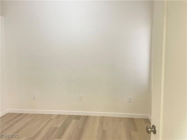 Empty room with light wood-style floors and baseboards | Image 15