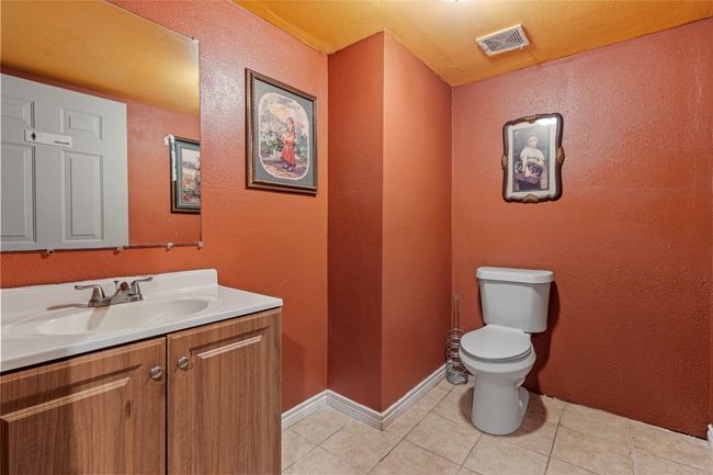 Bathroom featuring tile patterned floors, vanity, and toilet | Image 21