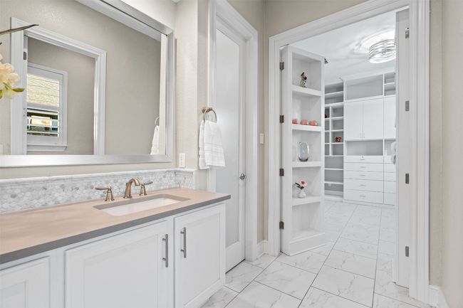 The attached walk-in closet connects to a hidden flex space behind a Murphy door—ideal as a nursery, dressing room, or office. | Image 21