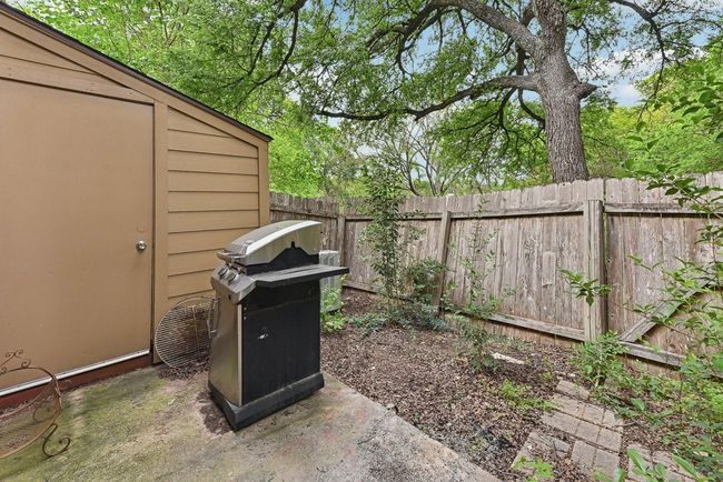 View of yard with a small fenced backyard | Image 26