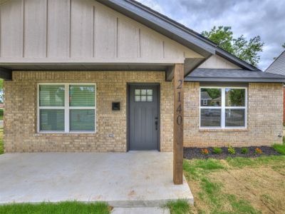 View of exterior entry featuring a patio area | Image 2