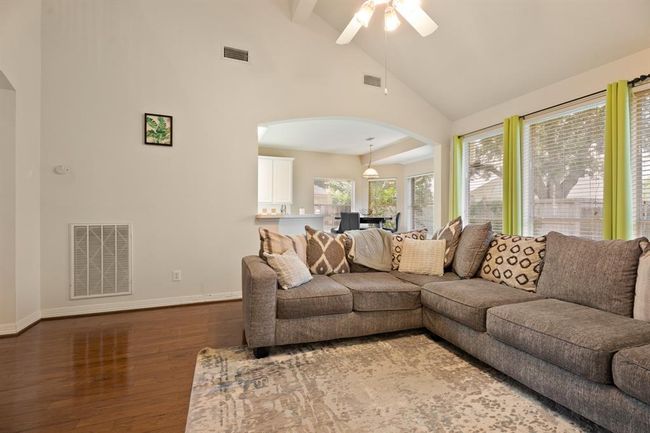 Notice the soaring ceilings… the living room is open to the kitchen and breakfast room. | Image 5