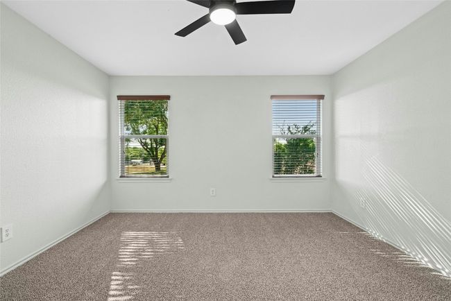 Unfurnished room with carpet and ceiling fan | Image 13