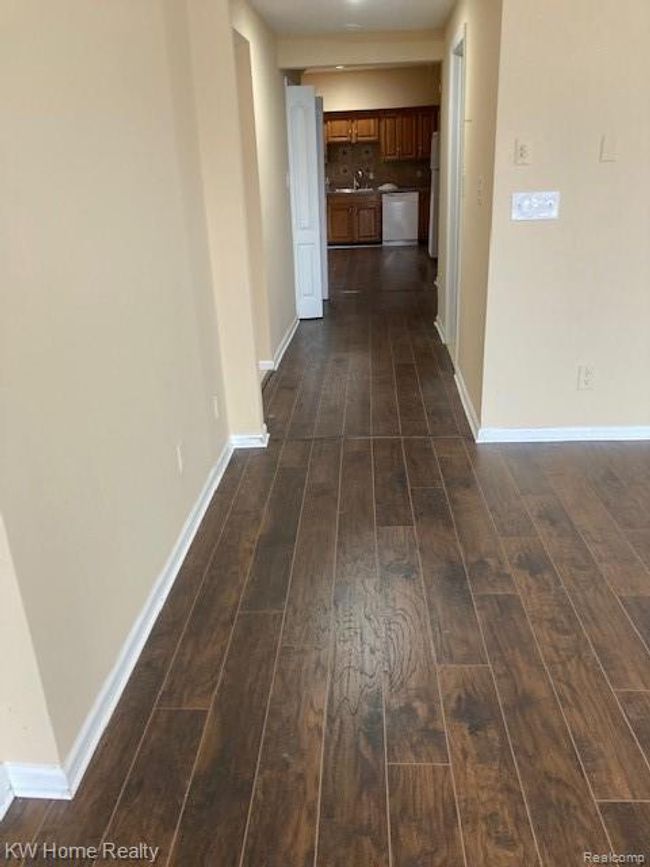 Hall way between great room and kitchen | Image 17