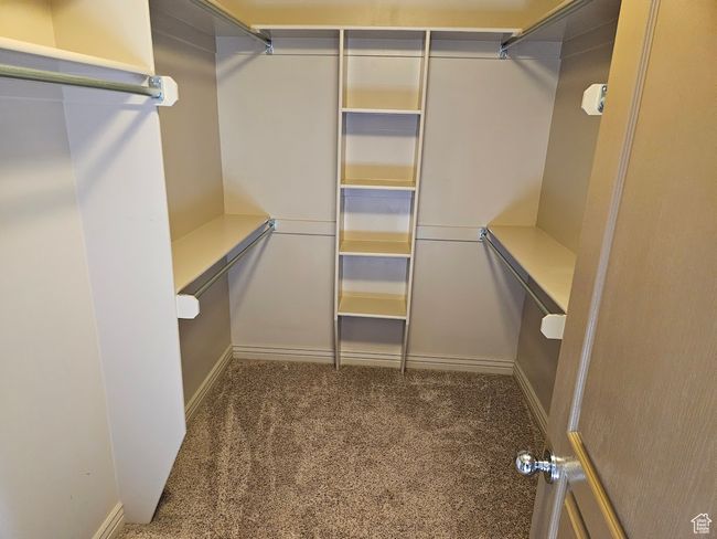 Spacious closet with carpet flooring | Image 36
