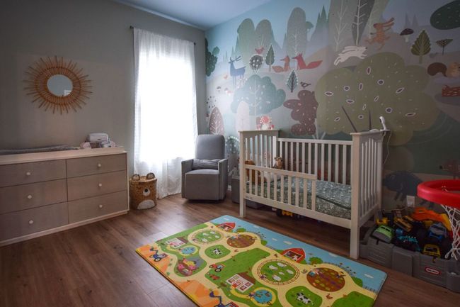 Bedroom featuring wood finished floors and a nursery area | Image 20
