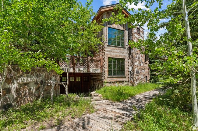 View of side of home featuring a wooden deck | Image 56