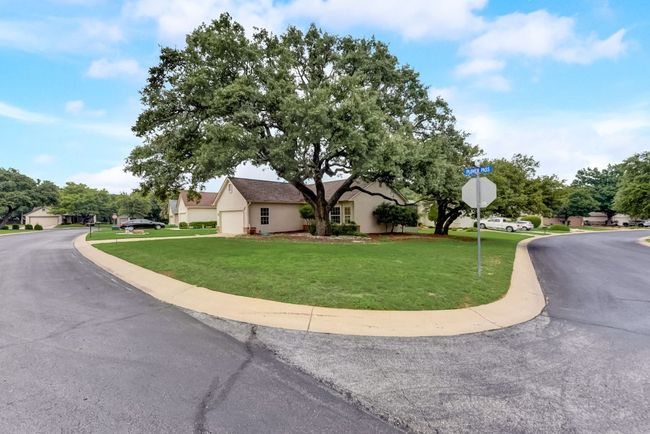 A charming exterior nestled under the shade of a majestic native live oak tree—where comfort meets natural beauty. ???? #SunCityLiving #GeorgetownTX | Image 8