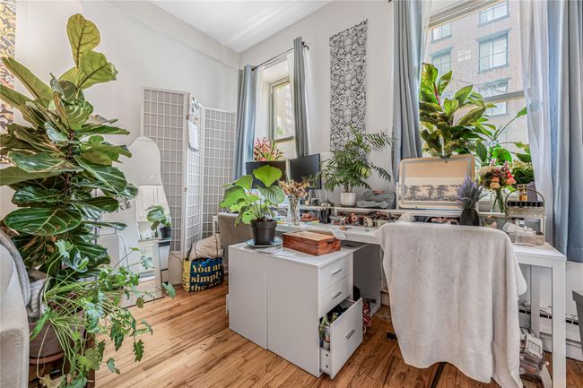 Home office with plenty of natural light and light wood-style floors | Image 5