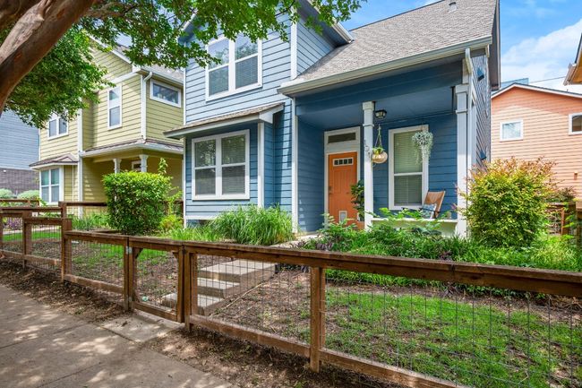 View of front of home featuring a porch and a shingled roof | Image 7