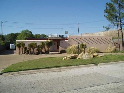 View of front facade with a front yard | Image 1