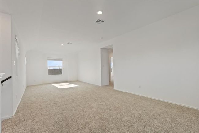 Spare room featuring light carpet, baseboards, visible vents, and recessed lighting | Image 11