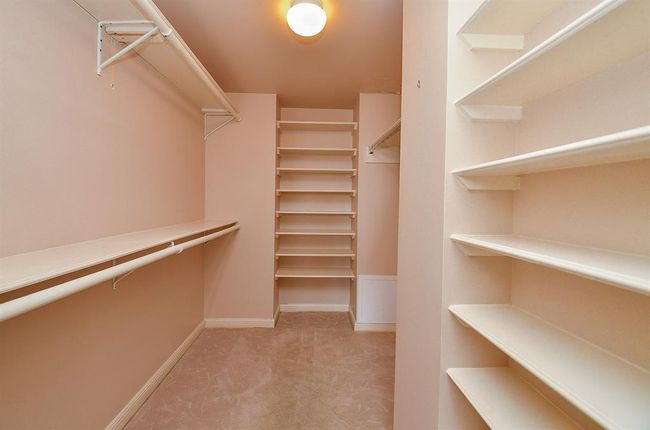 The walk-in closet is spacious. | Image 15