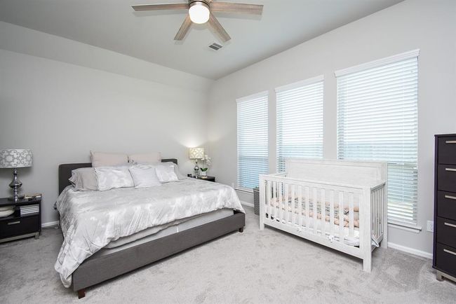 Primary bedroom with tall windows and lots of room. | Image 19